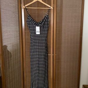 Sleeveless black and white polka dot Zara dress.